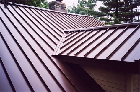 standing seam metal roof on traditional house|standing seam metal roofing near me.